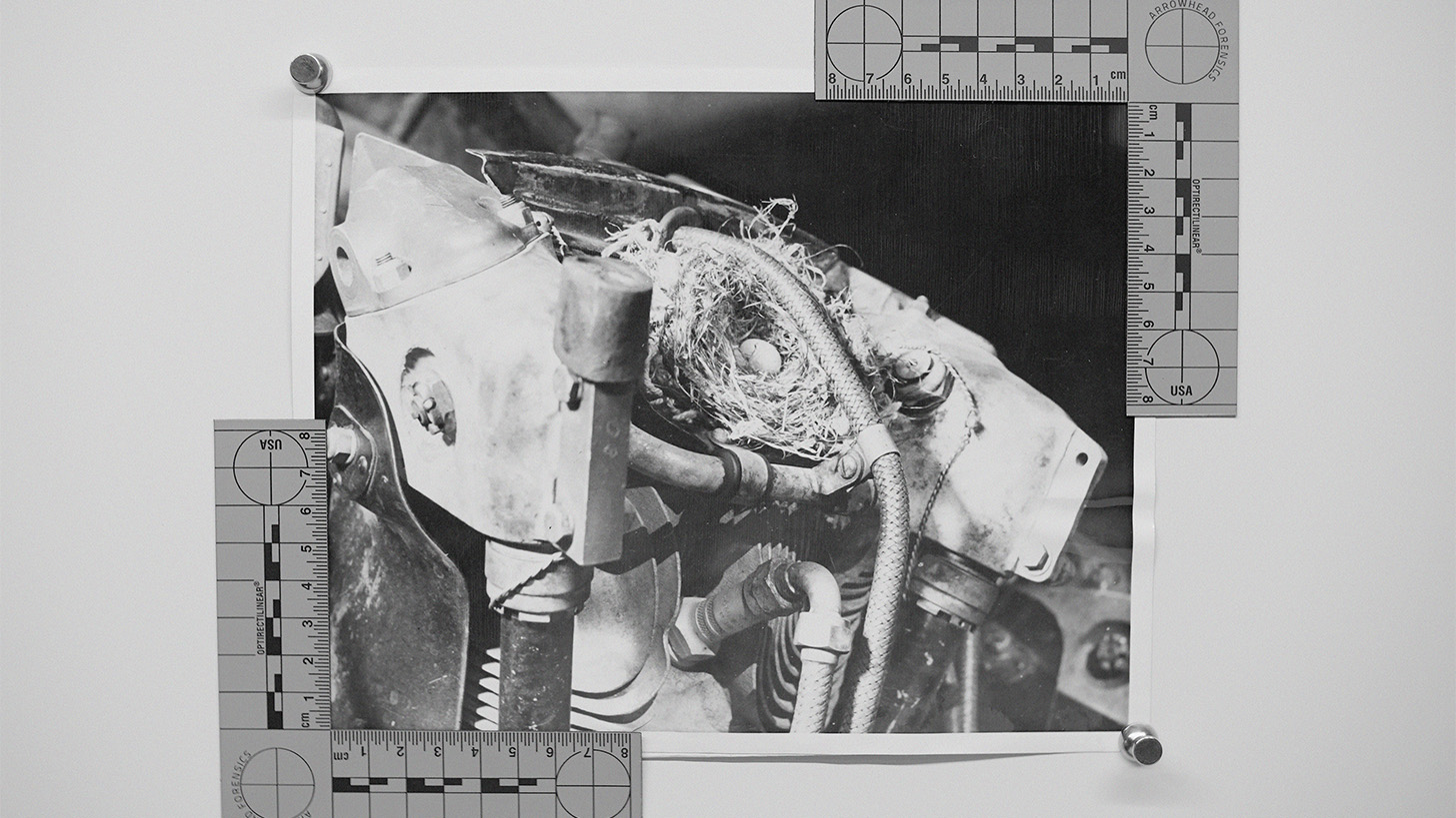 Abstract black and white photograph of machinery framed with rulers