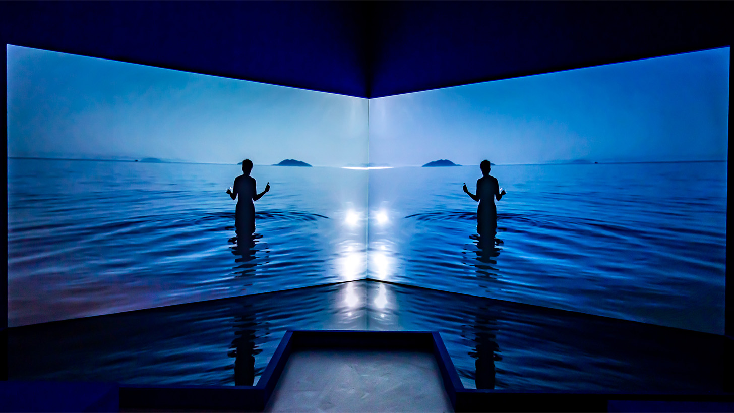 Two screens with silhouette of a person in deep blue sea