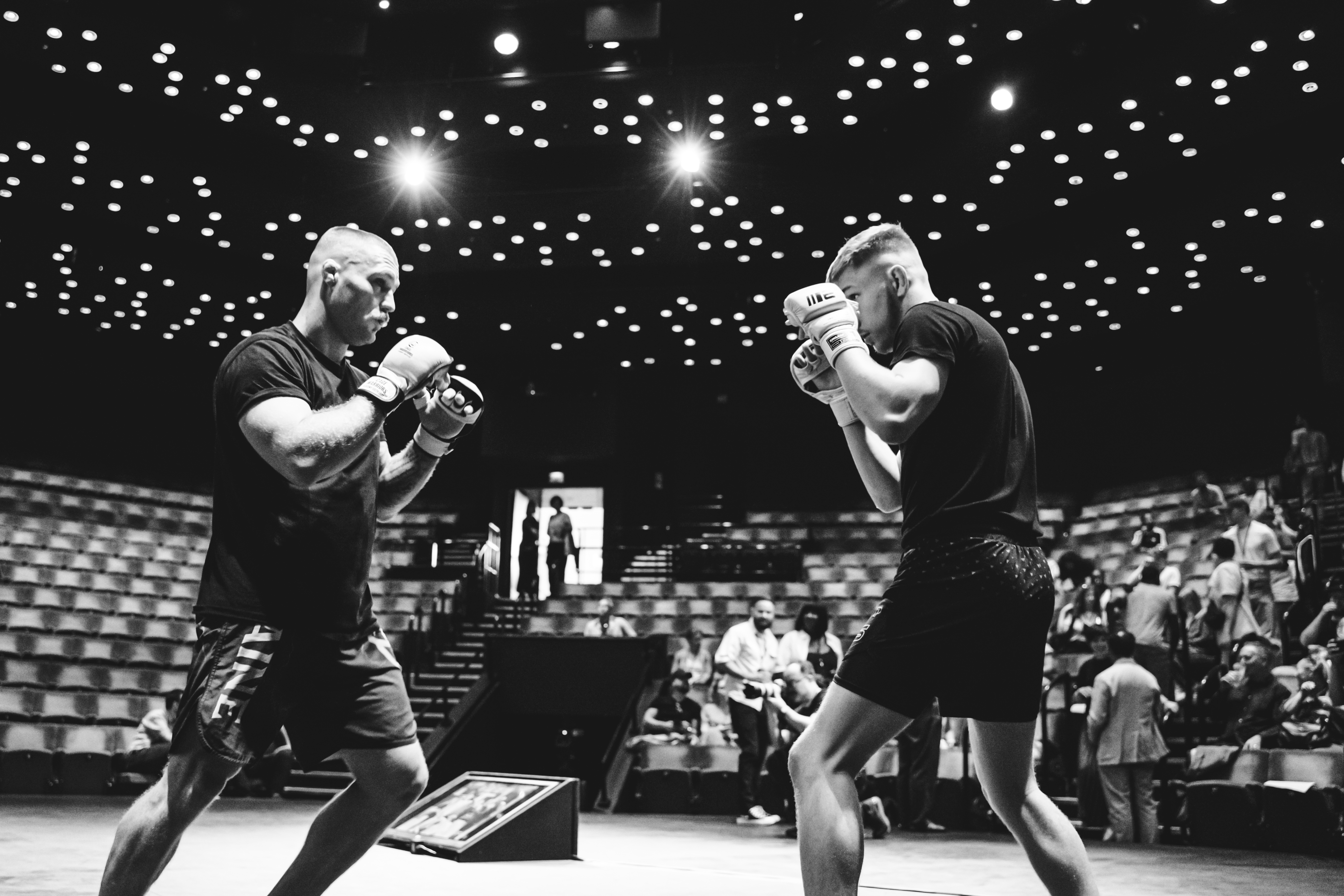 black and white image of two men boxing on the stage of The Crucible