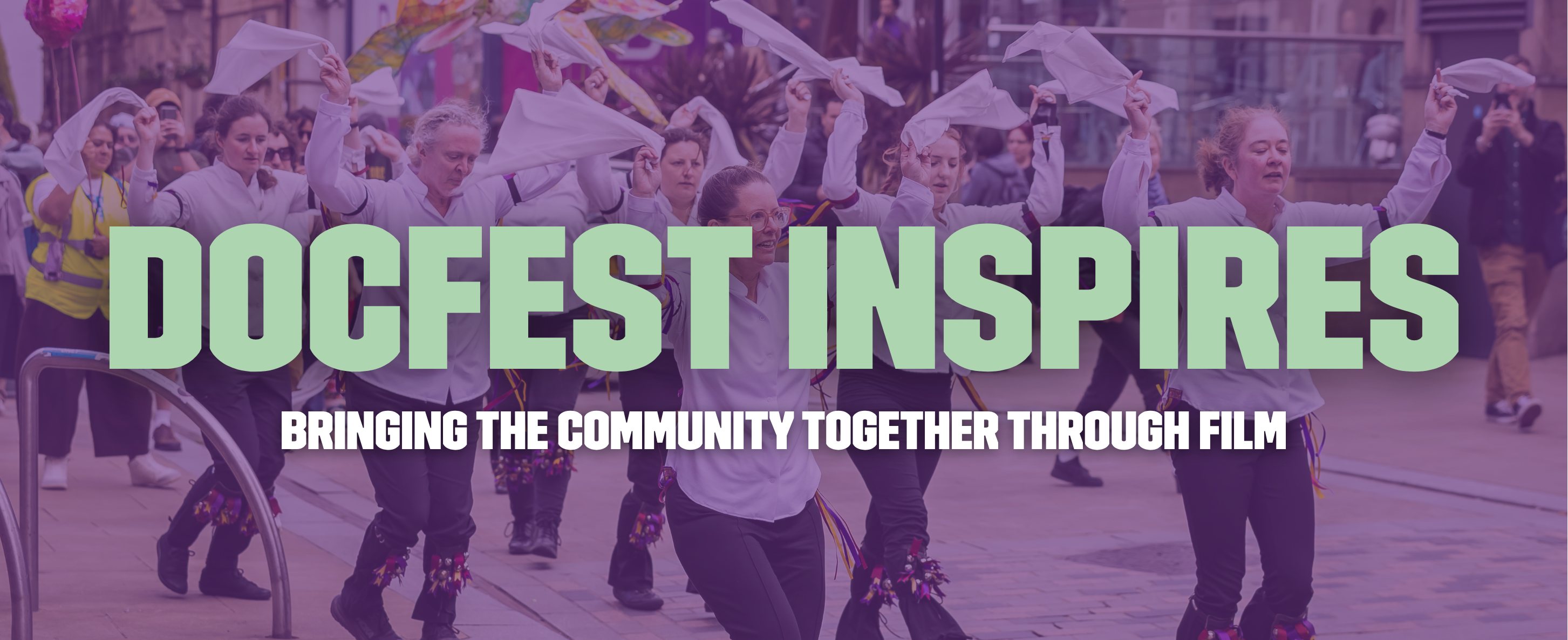 A banner with text reading "DocFest Inspires - Bringing the community together through film"