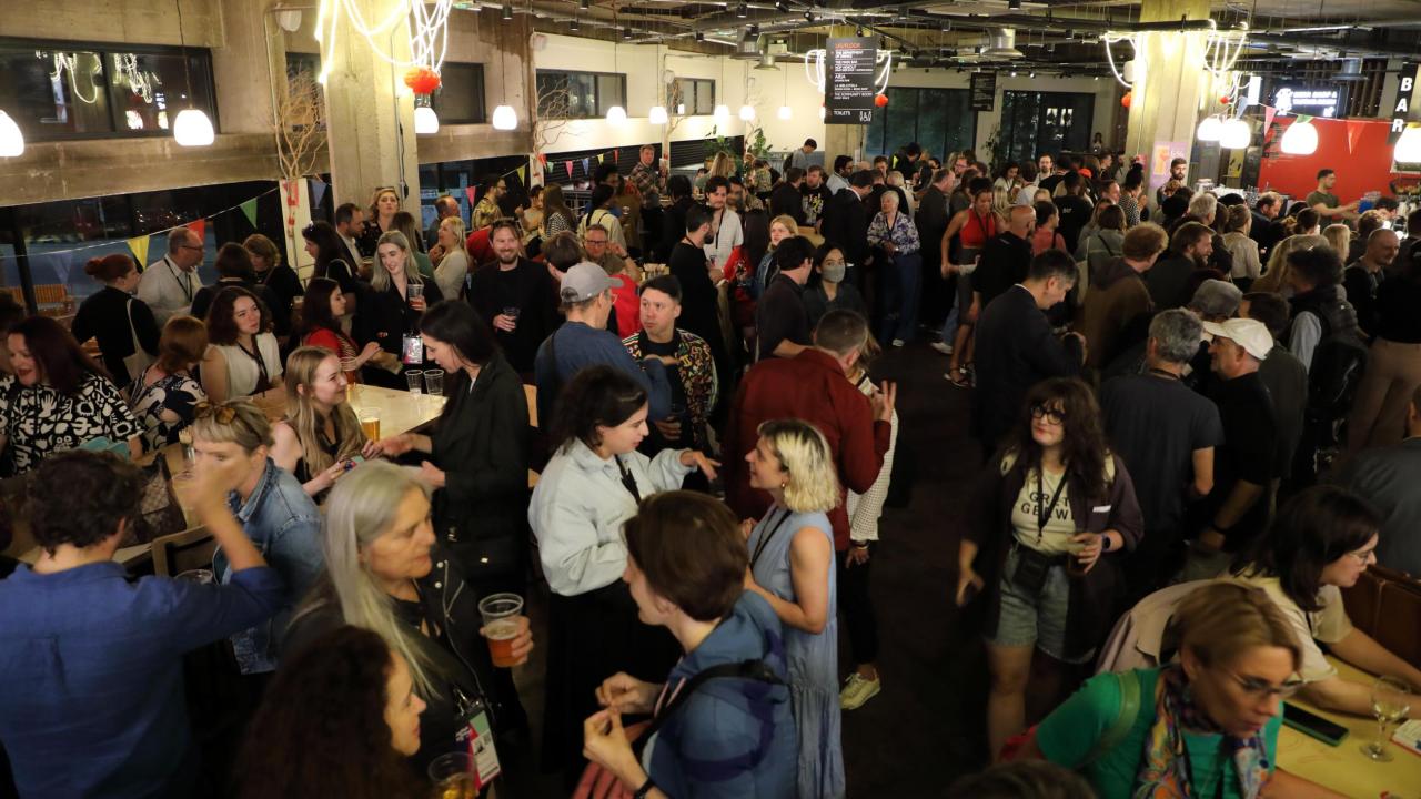 Crowded bar full of people.