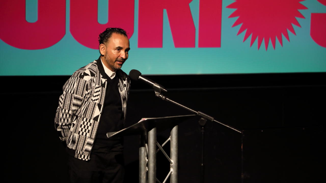 Sheffield DocFest’s Creative Director Raul Niño Zambrano stood at a podium mid speech