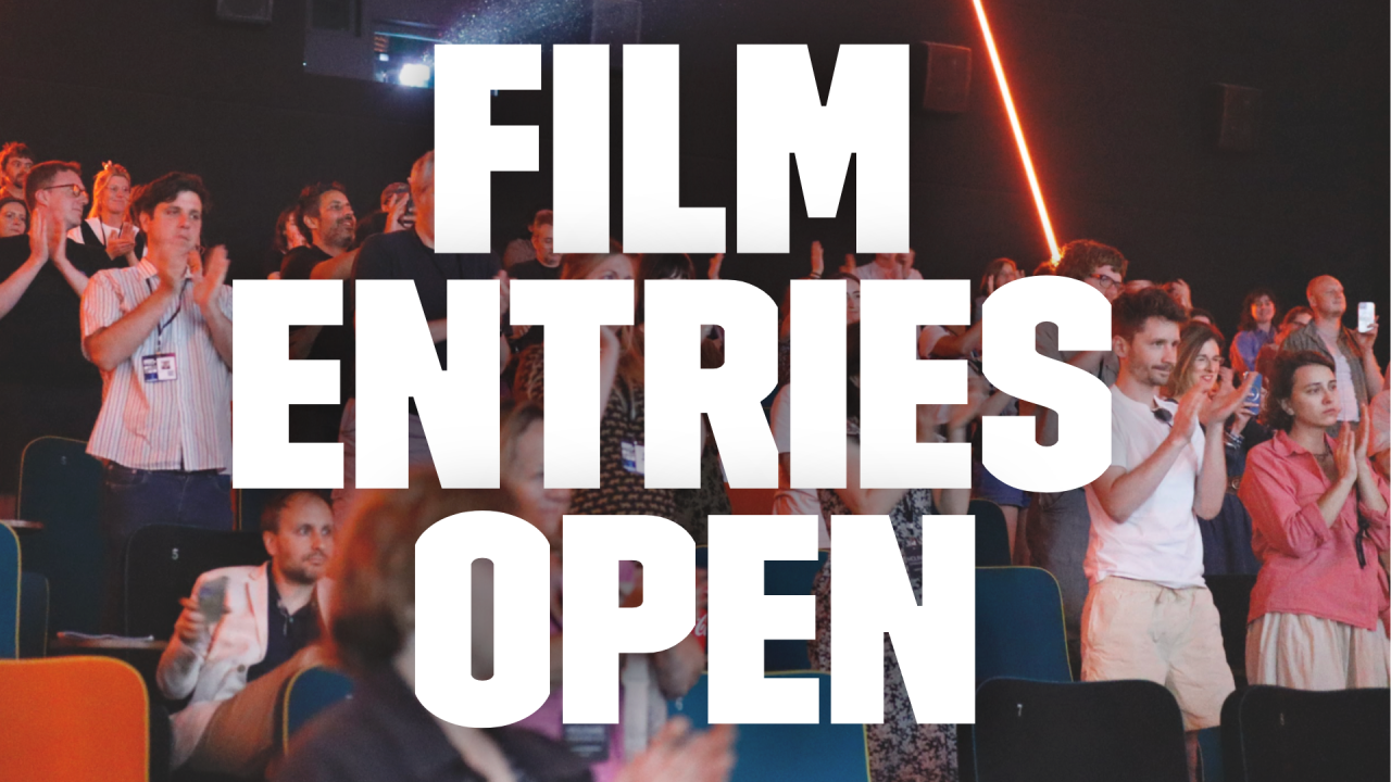 In the background image a busy cinema crowd stands to a round of applause. In large bold white text over the top of the image read 'film entries open'.