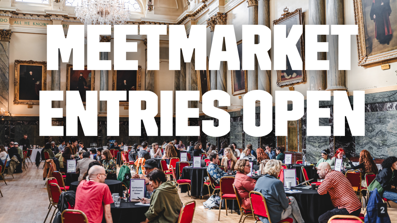 A busy room full of roundtables with people having meetings around them.