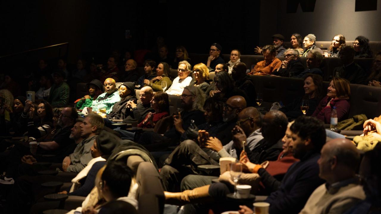 An audience watch a film at Bertha DocHouse, London.