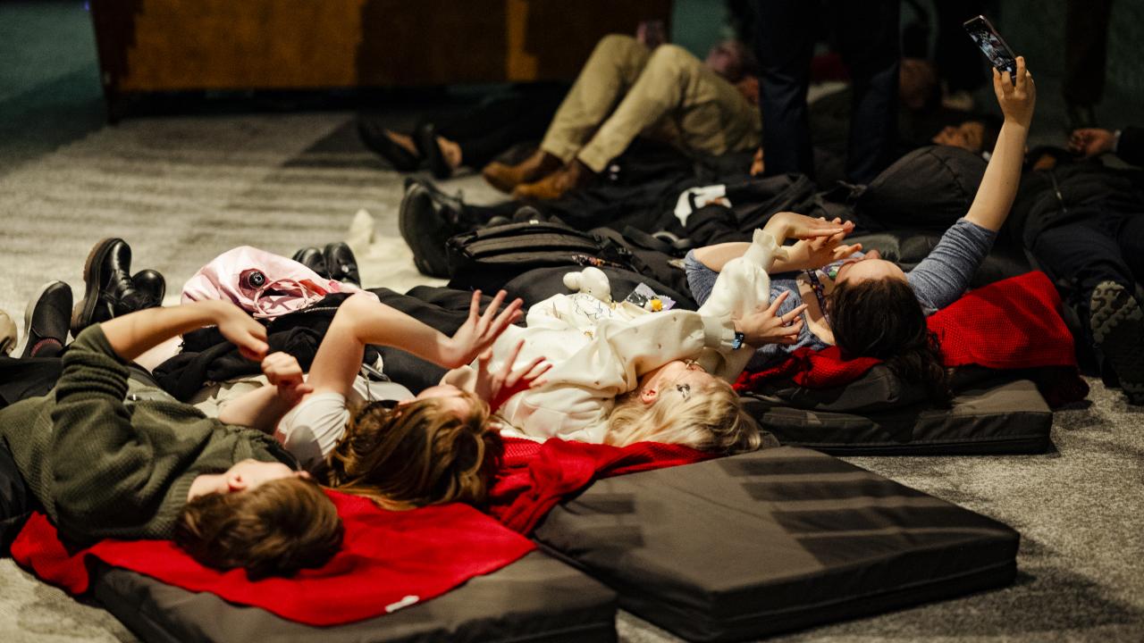A group of schoolkids attend an AR Exhibition