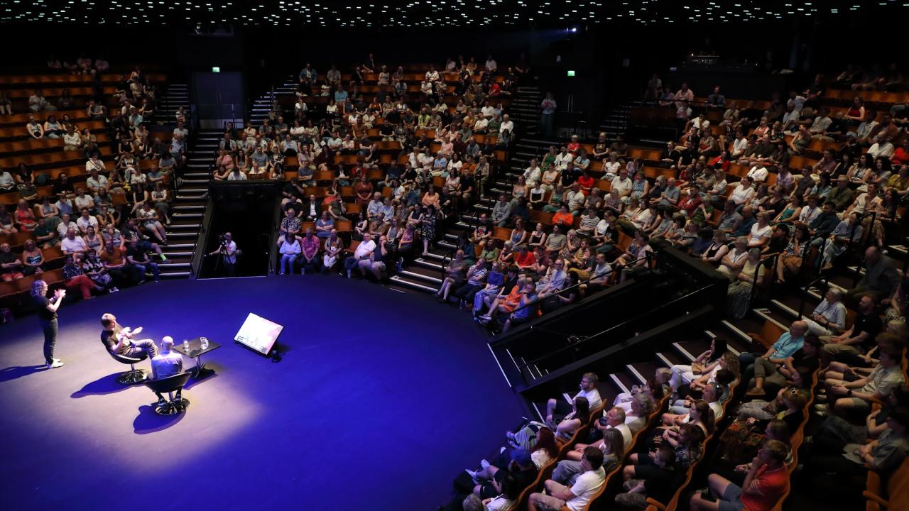 An audience watches an event at Sheffield DocFest.