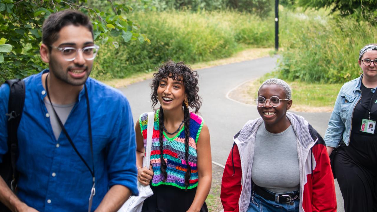 A group of young adults walk to Sheffield DocFest events.