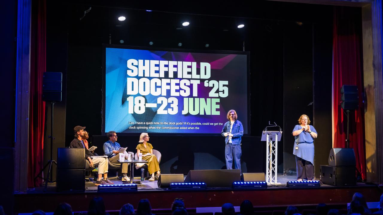 A group of people on stage at the Climate Spring Pitch event at Sheffield DocFest 2025.