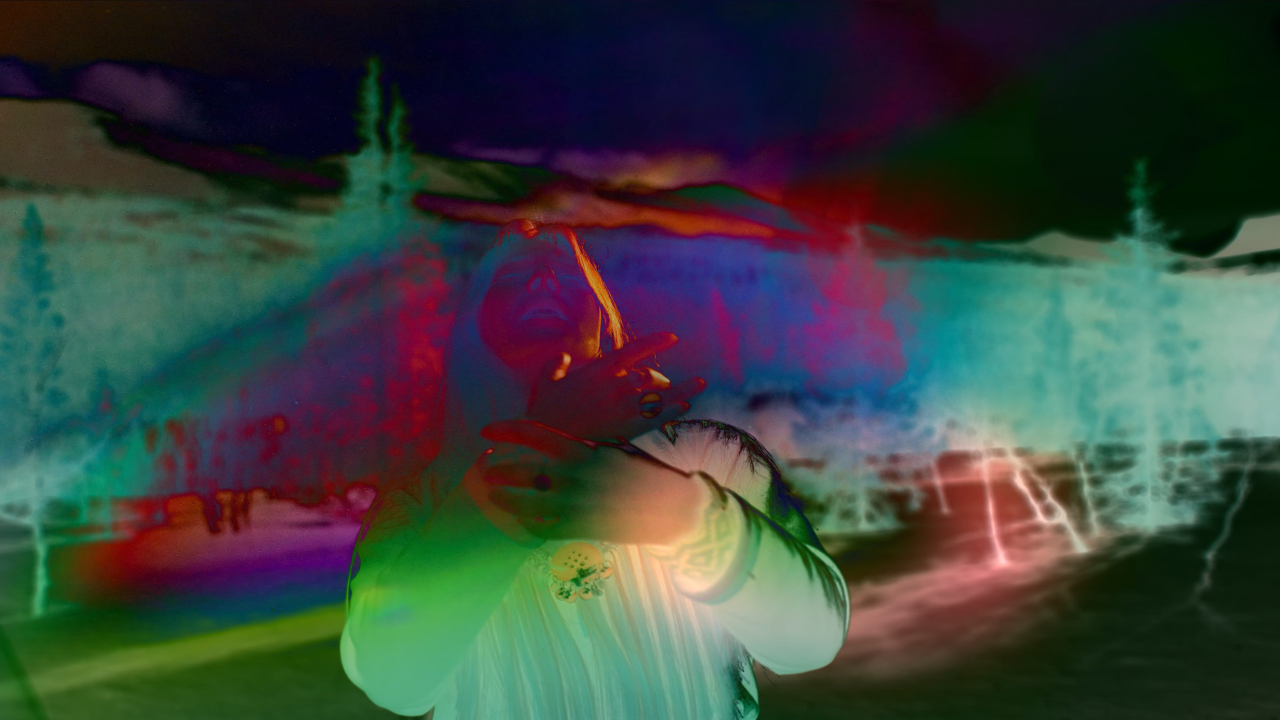 A still from the film TAKKUUK, which features a woman and inventive colours.