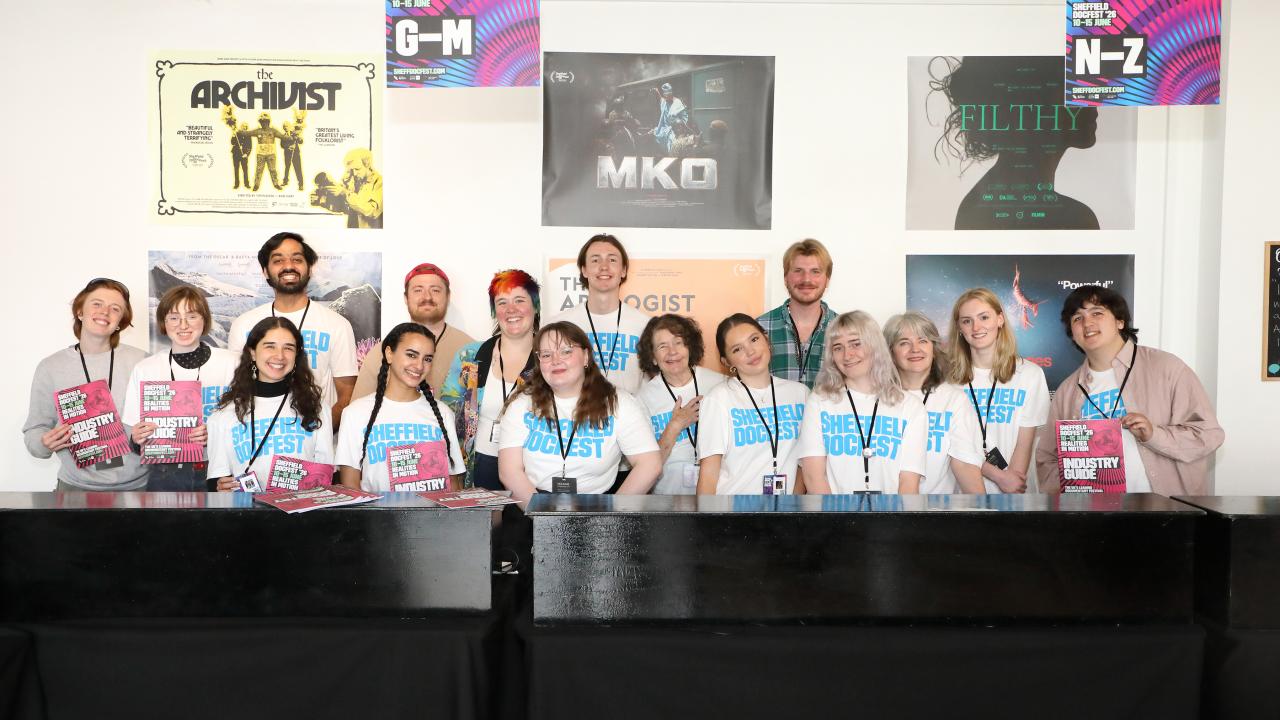 A group of Sheffield DocFest staff and volunteers pose for a photo.