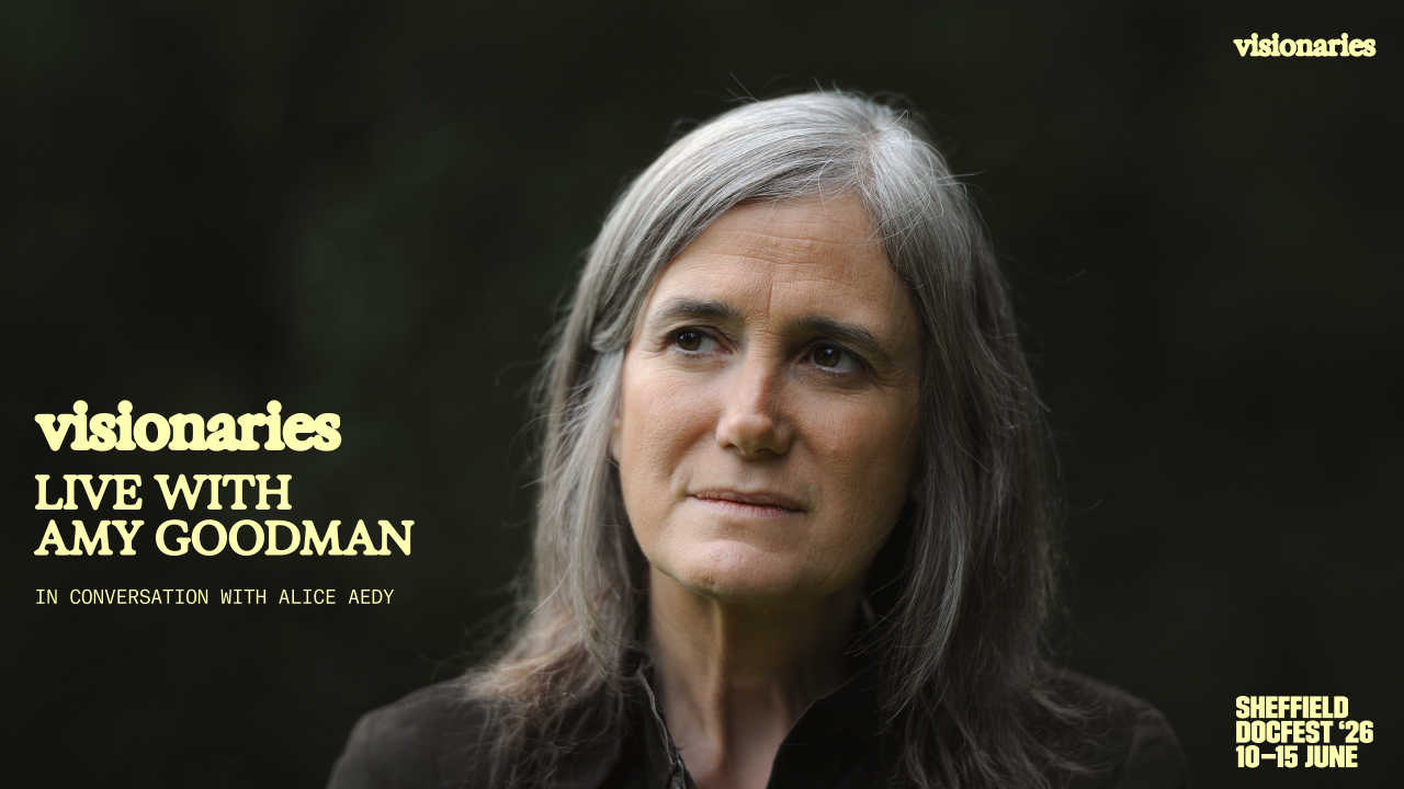 0 Amy Goodman Holding Screen.png