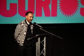 Sheffield DocFest’s Creative Director Raul Niño Zambrano stood at a podium mid speech